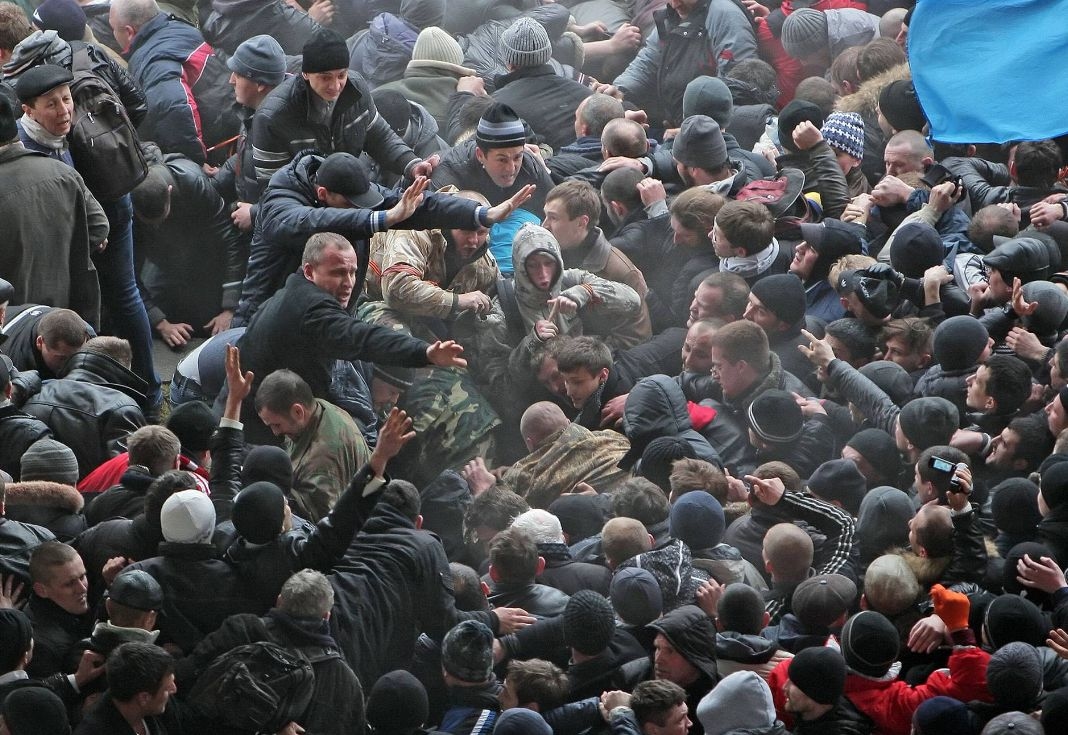 The confrontation between supporters of Ukrainian unity and pro-Russian activists outside the Crimean Supreme Council building in Simferopol, Ukraine, on February 26, 2014.  