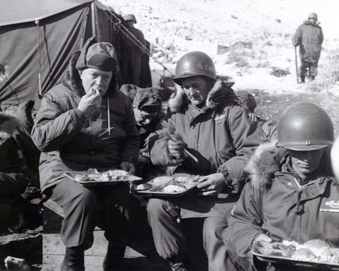 U.S. President-elect Dwight D. Eisenhower (left) dining with American soldiers in Korea. December 1952