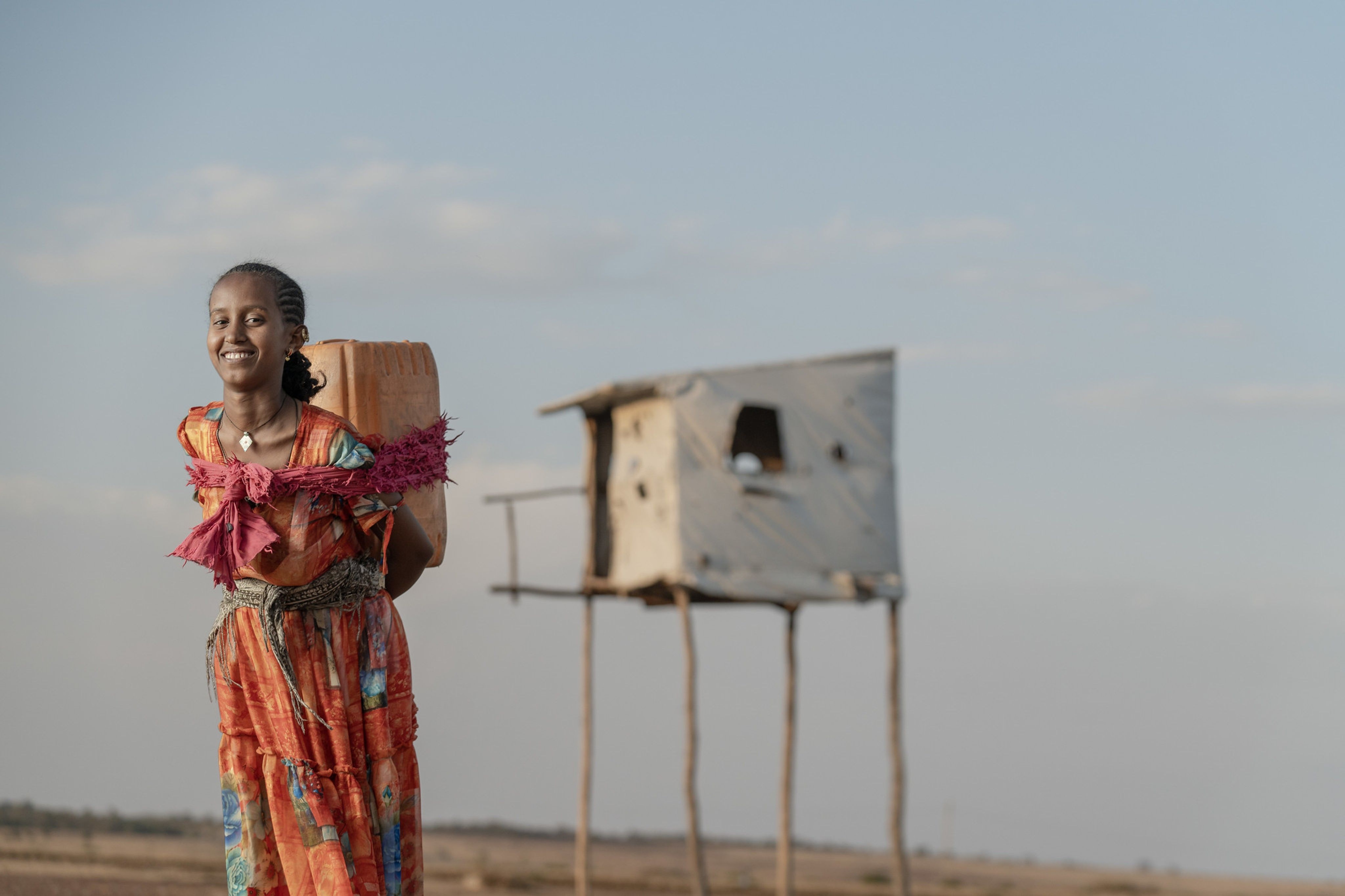A girl carrying a container of clean water, northern Ethiopia