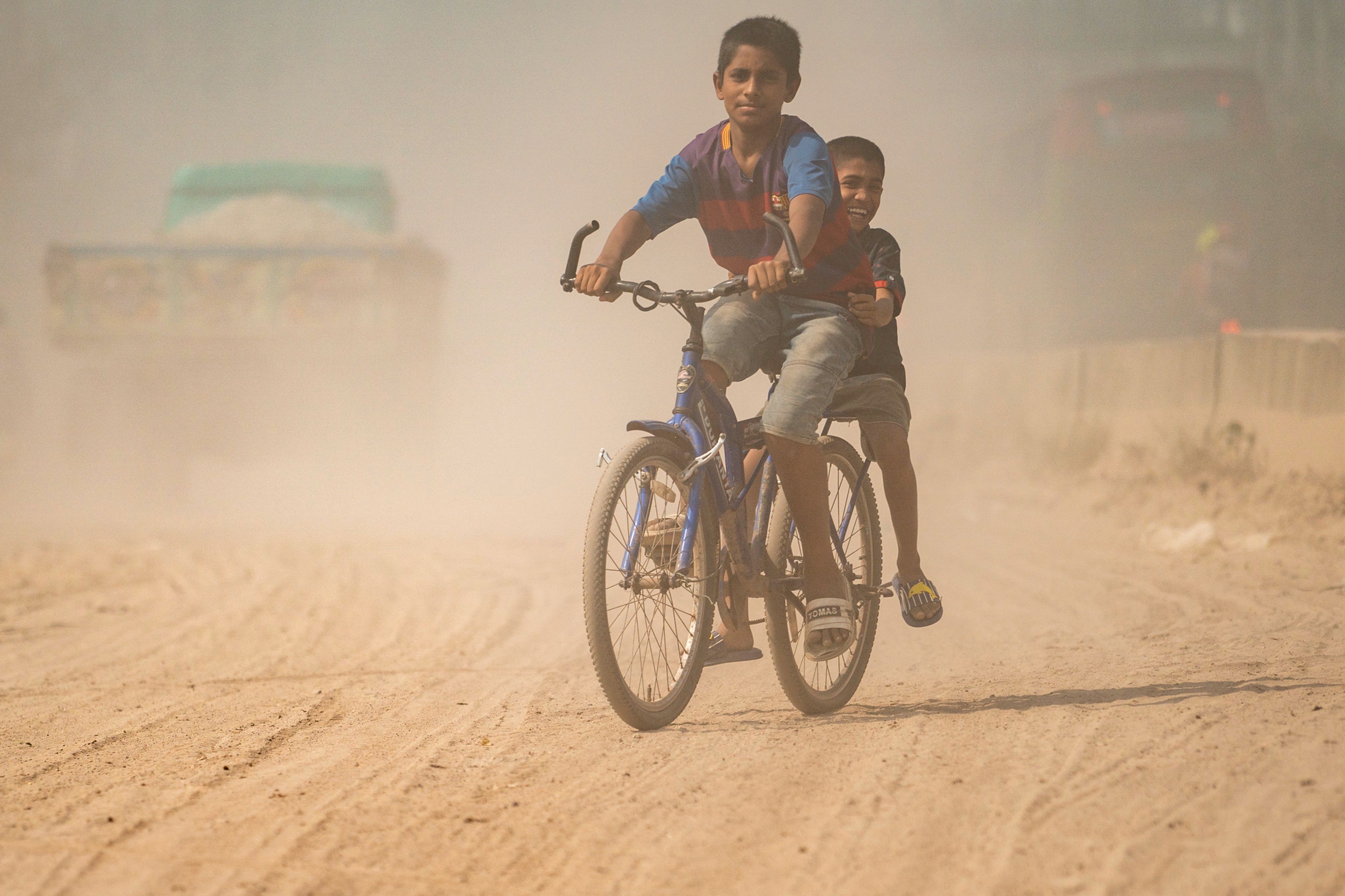 Children riding bicycles in Dhaka, Bangladesh
