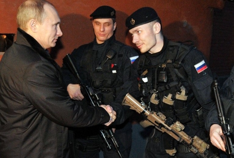 From left to right: Vladimir Putin, FSB Alpha Unit member Vadim Semenov, Alpha Unit member (now head of Center 795) Denis Fisenko during a visit to Chechnya's second-largest city, Gudermes, in December 2011