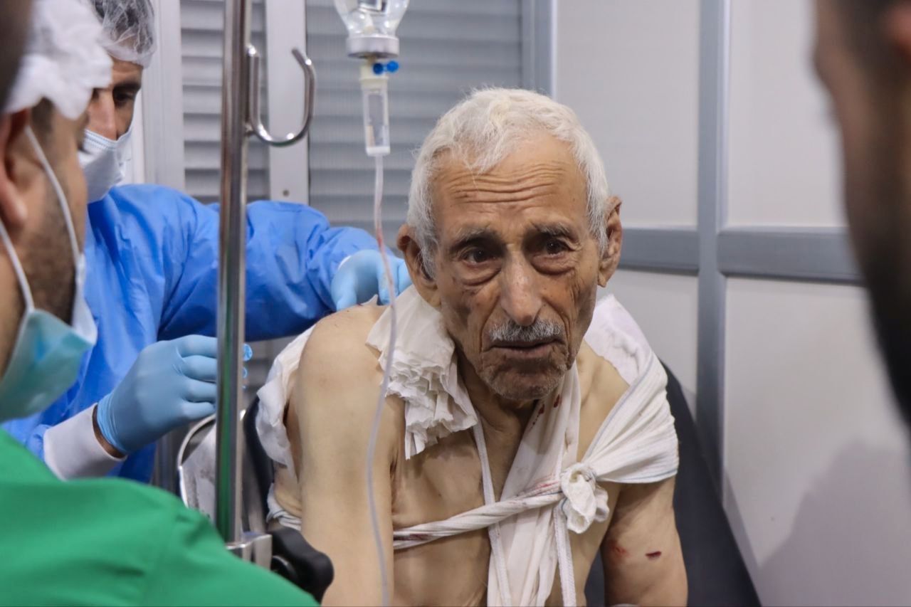 A resident of Idlib province receives medical assistance at a hospital following a strike by Russian airstrike on a refugee tent camp in Saraqib on Oct. 23.